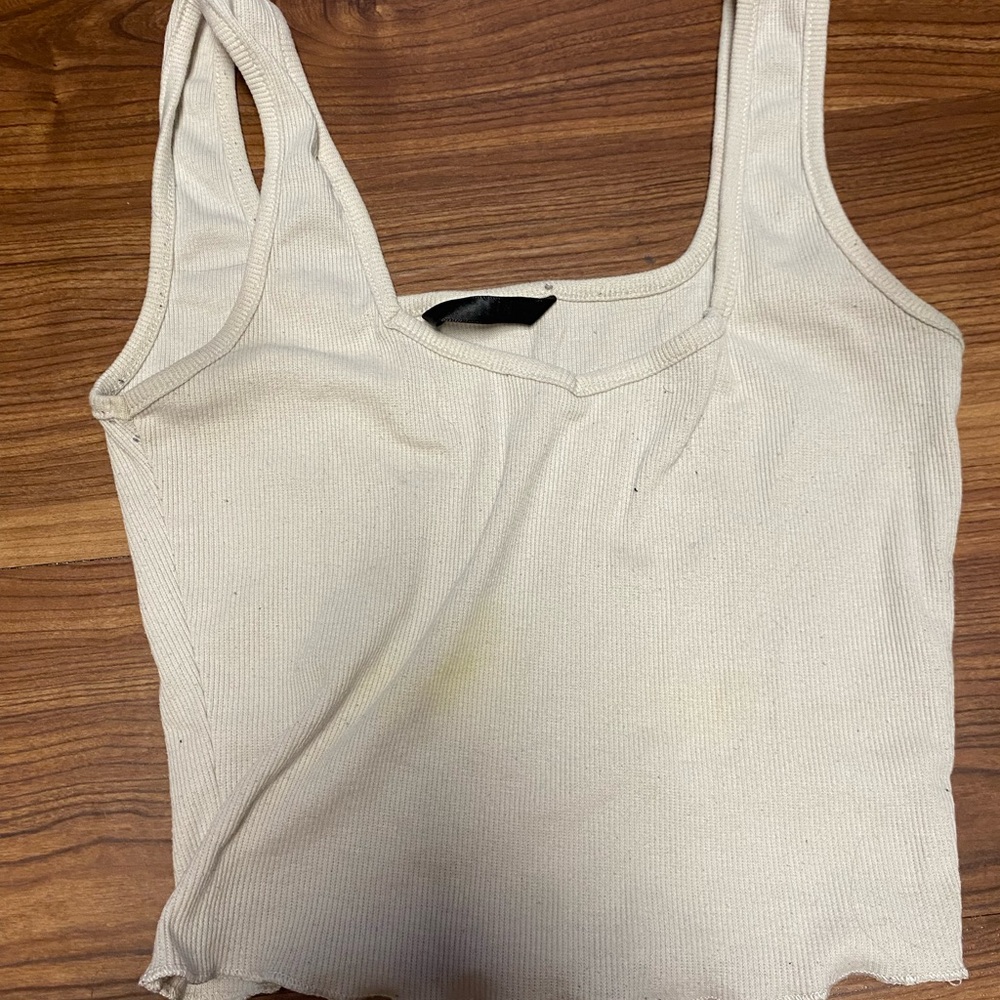 cream tank top! unsure of brand or size fits like a medium prob